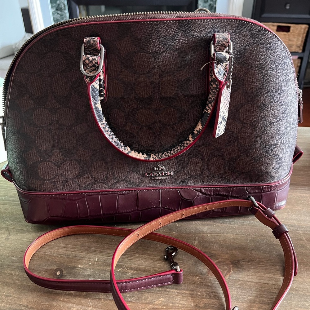Logo with maroon trim Coach dome bag